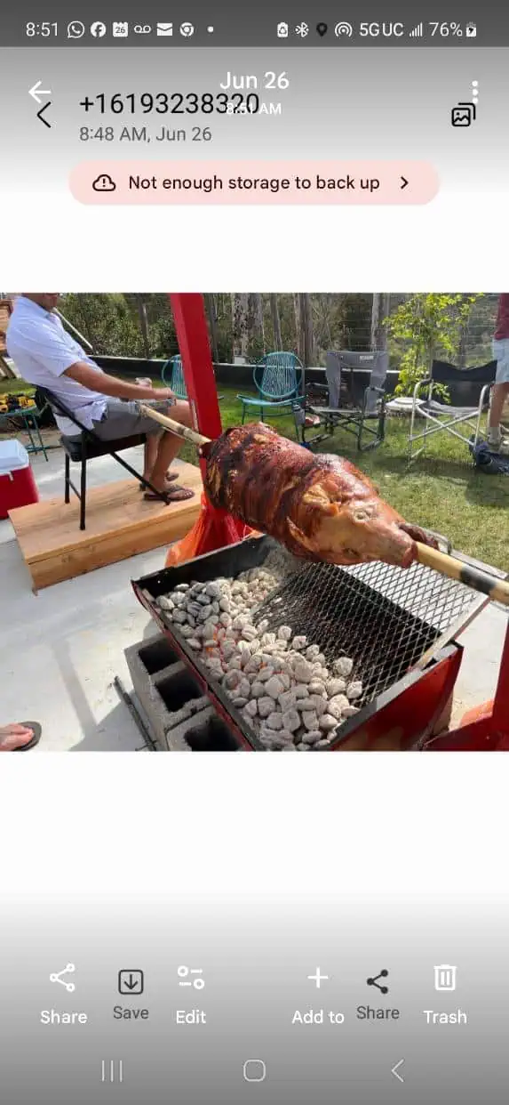 Outdoor grilling with Moss Grills, roasting meat over charcoal in a backyard setting.
