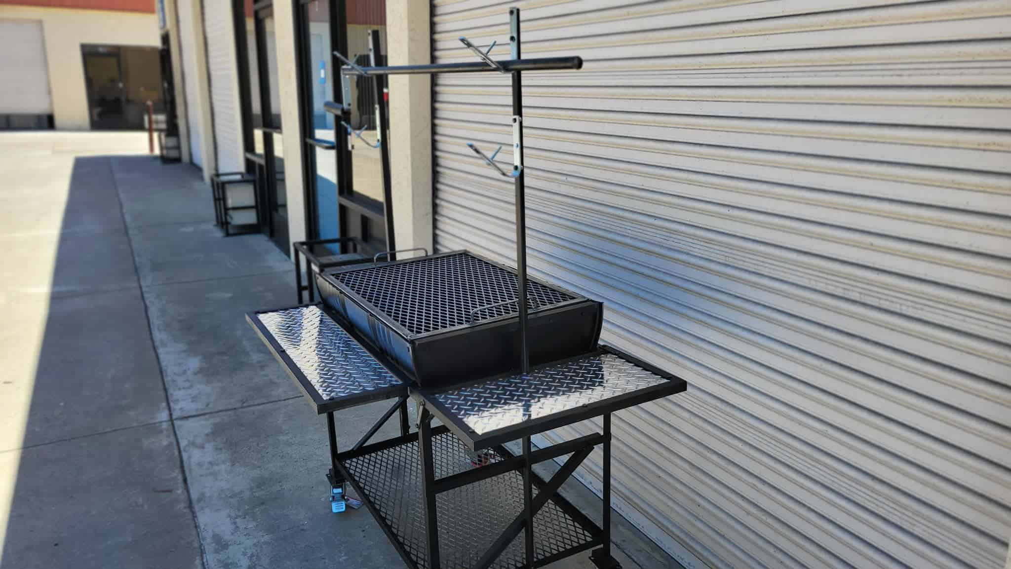 Outdoor cooking station with Moss Grills equipment and accessories.